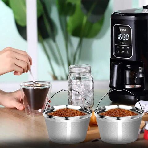Eco Friendly Reusable Stainless Steel Coffee Filter For 8 To 12 Cup Drip Brewers next to coffee maker and hand stirring coffee