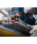 Worker using Three Pack Three And Five Eighth Inch Fourteen TPI Carbide Strip Jigsaw Blades T Shank For Laminates With Ten Times Life