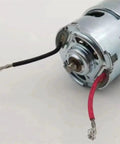 Close-up of Beefy 775 DC Gear Motor, 18V 120W With Ball Bearing, showing wiring and metal casing for RC and robotics projects.