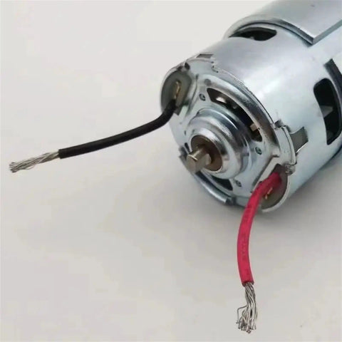 Close-up of Beefy 775 DC Gear Motor, 18V 120W With Ball Bearing, showing wiring and metal casing for RC and robotics projects.