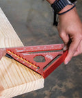 Seven Inch Double Laser Etched Aluminum Rafter Square With Badass Accuracy And No Hassle Multifunctional Carpenter Measuring Layout Tool Featuring Smooth Triangle Ruler For Tight Woodworking Cuts on wood.
