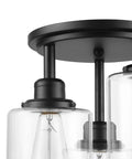Close-up view of Three Light Industrial Tiered Matte Black Flush Mount Ceiling Light With Clear Glass Shade Dimmable E26 Base