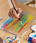 Artist using Gel Printing Plate 17.5x12.6cm For Monoprinting, Clear Silicone Reusable Printing Plate for colorful design creation.