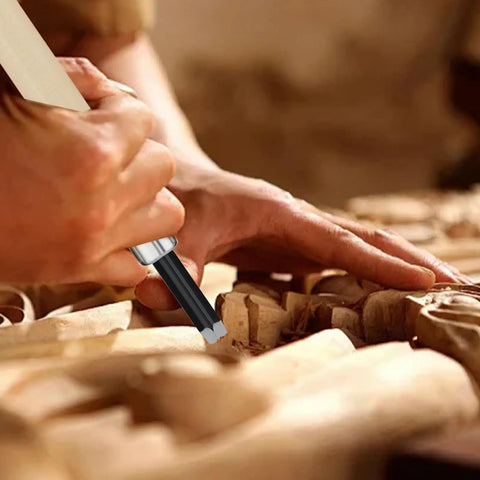Close-up of a hand using a Pro Grade Ten Piece Wood Carving Chisel Set Forged From Heat Treated Chrome Vanadium Steel.