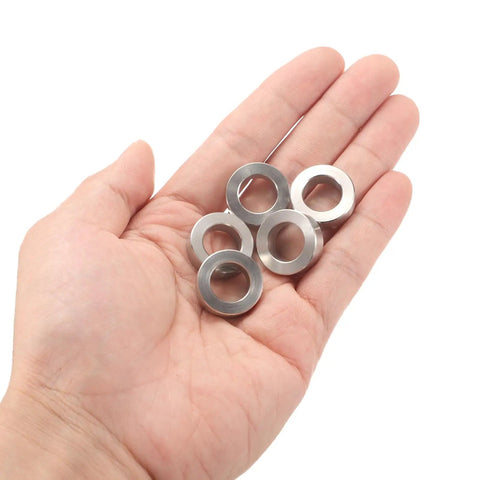 Hand holding 12 Piece Stainless Steel Spacer Set 12mm Bore 20mm OD 6mm Length For M12 Screws Bolts And Rods Plain Finish 304 Stainless Steel Construction Heavy Duty Corrosion Resistant Round Metal Spacers