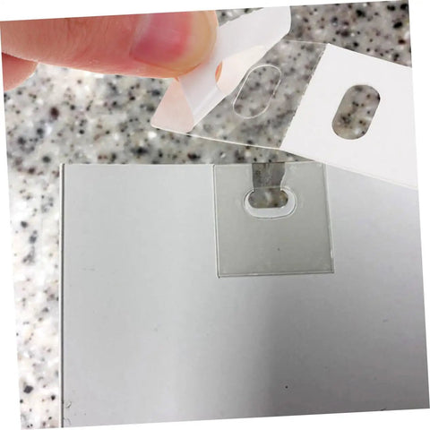 Applying a patch from the Vertical Blinds Repair Stickers Kit 50 Pieces No Fuss Easy DIY Fix For Damaged Slats Invisible Tape Patches.