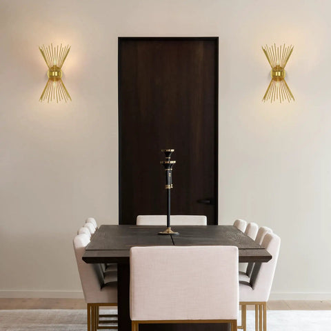 Dining room with Brass Mid Century Modern Wall Sconces Set Of 2, Brushed Brass Starburst Wall Lighting on either side of dark door.