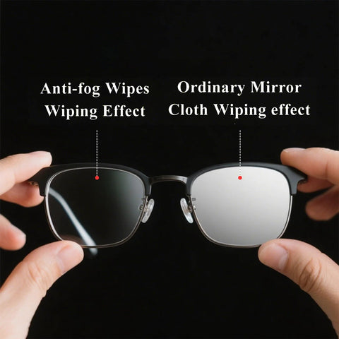 Front view of black-frame glasses held apart to compare anti-fog wipe on left lens vs ordinary mirror cloth on right.