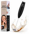 Compact Black Espresso Machine Bundle Pushing 20 Bar Pressure For Rich Creamy Crema In Just 30 Seconds Includes Dual Sided Capsule Holder And Two Glass Cups And Handheld Milk Frother. Milk frother in action creating froth.