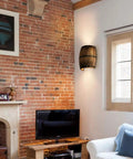 Living room with brick wall featuring Antique Wood Wine Barrel Wall Sconce For Bar Area With Up And Down Lighting Steampunk Vibe Indoor Wall Lamp