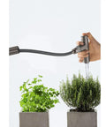 Pull-Down Kitchen Faucet Hose In Chrome Small Size watering plants, showing flexible design and durable brass core, easy install