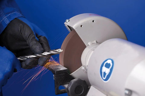Heavy Duty Vitrified Bench Grinding Wheel Six Inch By One Inch With One One Quarter Arbor Thirty Six Grit Aluminum Oxide Coarse Profile in use grinding drill bits.