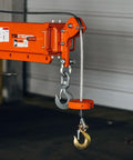 Heavy Duty Fork Mounted Jib Crane With Electric Winch Pivoting Telescopic Boom Extends To 138 Inches showing hook and cable.
