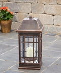 San Rafael II Solar Mission Lantern With Dual High Performance Warm White LEDs And Amber Pillar Accent on patio