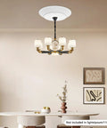 Heavy Duty Electric Hoist Lift System For Chandeliers 2 In 1 Switch Holds 110 Lbs White Metal with chandelier in dining area