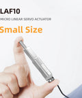 Micro Linear Servo Actuator With Force Control Sensor, 10mm Stroke, 56N Peak Force, held between fingers, compact size