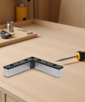 4 Pieces Aluminum Alloy Sofa Legs Replacement For Cabinets And TV Stands L Shaped Design on wooden table with tool