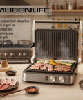 4 Slice Panini Press Contact Grill With Removable Non Stick Coated Plates Temperature Control Timer And Open 180 Degree Design For Cooking Sandwiches Steaks Sausages Quesadillas Half Black Stainless Steel Finish in use with grilling meats and veggies on kitchen counter.