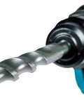 Close-up of Makita SDS-Plus carbide-tipped drill bit mounted in a blue rotary hammer