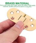 Top Tier Pack of Heavy Duty Brass Table Folding Hinges With 180 Degree Rotation For Sewing Machines Desks And Doors Super Smooth Quiet Flip Top Hardware, held in hand, showing durable brass material.