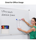 Woman using magnetic dry erase marker holder and pencil cup on whiteboard, showing tough magnets. Focus: Magnetic Dry Erase Marker Holder And Pencil Cup For Whiteboards, Tough Magnets That Grip Metal Surfaces, Attaches To Office Fridges, Lockers, And Metal Cabinets, Adjustable Divider, 2 Pack.