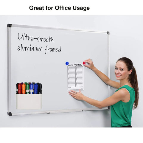 Woman using magnetic dry erase marker holder and pencil cup on whiteboard, showing tough magnets. Focus: Magnetic Dry Erase Marker Holder And Pencil Cup For Whiteboards, Tough Magnets That Grip Metal Surfaces, Attaches To Office Fridges, Lockers, And Metal Cabinets, Adjustable Divider, 2 Pack.