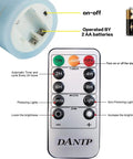 Remote control for Cozy Flameless Candle Set With Embedded String Lights 5 Piece Real Wax LED Candles showing timer options and AA batteries.