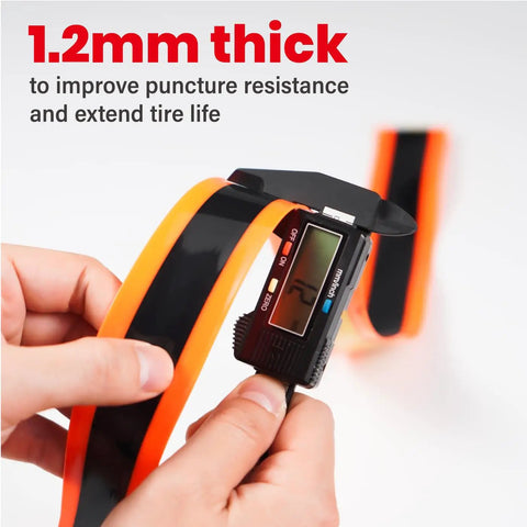 Road Bike Tire Liner Self Adhesive Inner Tube Protector being measured for thickness with digital caliper