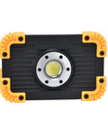 YWBL-WH Mini COB Emergency Flood Light, 6-Angle Adjustable Stand with sturdy black body and yellow rubber corners.