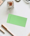 60 Pack Green Kraft Paper Coin Envelopes Self Seal With Double Adhesive Vintage Style Envelopes on desk