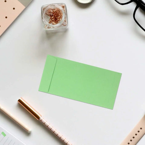60 Pack Green Kraft Paper Coin Envelopes Self Seal With Double Adhesive Vintage Style Envelopes on desk