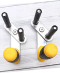 Portable Gypsum Board Lifter Set With Adjustable Angle Grip For Hassle Free Drywall And Ceramic Tile Transport Labor Saving Lightweight Carry Tool showing metal hooks with yellow grips.