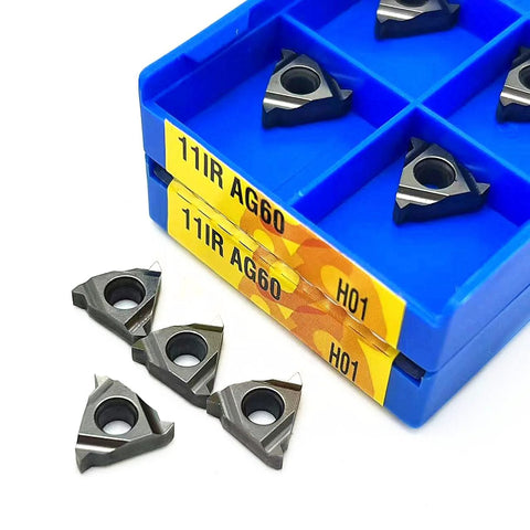Carbide turning inserts for 11IR/11ER AG60 H01; gray triangular inserts with center hole in blue storage case.
