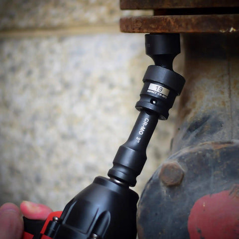 Heavy Duty 18-Piece One-Half Inch Drive Shallow Universal Impact Socket Set With Swivel And Flexible Wobble during use on a bolt.