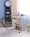 Adjustable Height Portable Laptop Table With Easy Roll Casters And Hidden Storage Shelf Folding Sofa Bed Tray Heavy Duty Steel Frame Mobile Standing Desk For Dorm Room No Hassle Workspace in a stylish room setting.