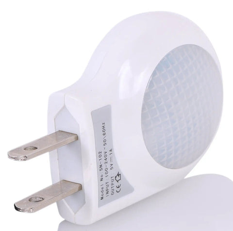 Portable Plug In 0.7W Travel LED Night Light Two Pack White Ultra Low Power Night Lamp With Narrow Design That Fits Outlets Gentle Bright White Glow For Hallways Bedrooms Kids Rooms Energy Saver showing side view with prongs