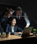 Black Dope Daylight Table Lamp with Realistic Daylight Simulation illuminating group working on laptop