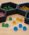 Hexagonal Magnetic Board Game Tray Organizer Set With Flexible Layouts 7 Pack in black with colorful dice pieces visible.