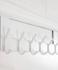 Over The Door Hooks White 6 Pack Towel Rack And Coat Hanger installed on door, white hooks with soft sponge padding visible