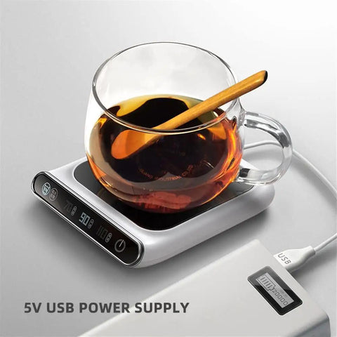 Smart USB Coffee Mug Warmer With Three Temp Settings Keeps Your Daily Brew Nice And Toasted Flat Bottom Heat Pad For Office Home Desk Warm Drink Setup with a glass cup on a heater.