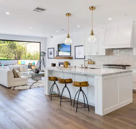 Modern Brass Seeded Glass Pendant Light With Dimmable Hanging Fixture Handblown Clear Glass Shade With Tiny Bubbles Warm Brass Finish And Braided Cord For Kitchen Island Or Dining Area in a modern kitchen setting