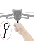 Hand holding drone handheld stabilizer and lens bracket mount for Air 3S dope one shot cinematic takeoff and landing.