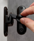 Crazy Tough Heavy Duty Barn Door Lock 90 And 180 Degree Flip Latch Kit installed on door with anti-theft knob lock