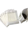 Grab And Go Portable Disposable Drip Coffee Bags With Hanging Ear, open filter bag with beans and a stack of closed bags.