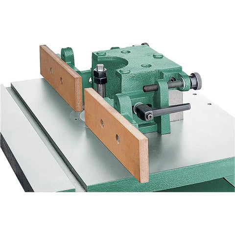 Built Like A Tank One Point Five Horsepower Woodworking Shaper Featuring Massive Twenty By Eighteen Inch Cast Iron Table And Dual Voltage Motor - close-up of shaper details.