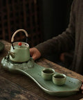 Top Shelf Glazed Ceramic Tea Tray With Retro Textured Finish No Fuss Dry Brewing Platform And Built In Drip Tray For Authentic Kung Fu Sets coffee table setup with tea pot and cups.