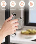Hand using Two Pack Suction Cup Door Handles No Drilling Waterproof Knobs for windows and sliding doors on glass surface.