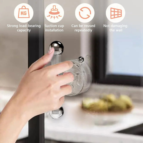 Hand using Two Pack Suction Cup Door Handles No Drilling Waterproof Knobs for windows and sliding doors on glass surface.