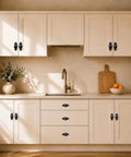 Level Up Your Home Game With These Slick Matte Black Cabinet Knobs Featuring A Heavy Duty Decorative Backplate on kitchen cupboards.