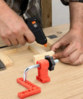Sixteen Piece Right Angle Clamp Set For Woodworking with 90 Degree Positioning Squares on a wooden workbench